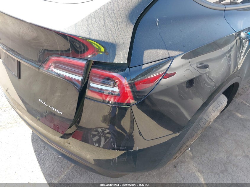 2023 Tesla Model y VIN 7SAYGDEE7PA125907 IAAI salvage auction — LEFT REAR, Salvage Title, sold $7,900 on 2026-07-08 (photo 4)