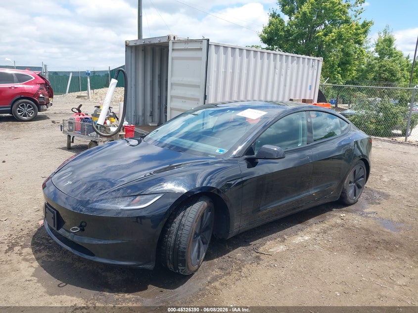 2025 Tesla Model 3 VIN 5YJ3E1EB9SF906618 IAAI salvage auction — SIDE, Salvage Title, sold $12,700 on 2026-07-20 (photo 2)