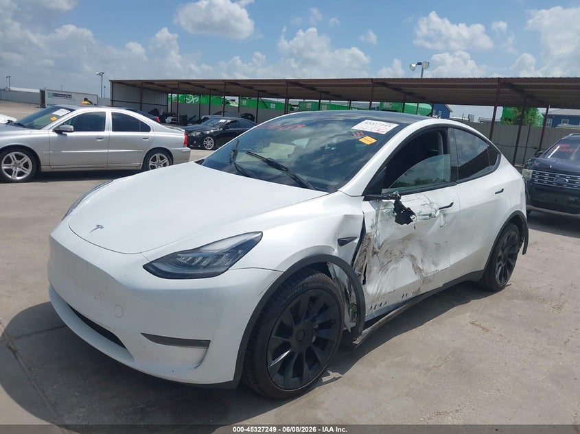 2023 Tesla Model y VIN 7SAYGDEE4PA101130 IAAI salvage auction — SIDE, Salvage Title, sold $11,100 on 2026-07-22 (photo 2)