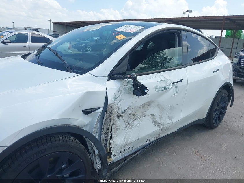 2023 Tesla Model y VIN 7SAYGDEE4PA101130 IAAI salvage auction — SIDE, Salvage Title, sold $11,100 on 2026-07-22 (photo 6)