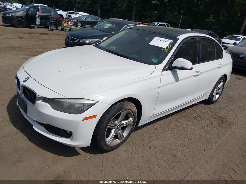 2012 BMW 3er VIN WBA3A5G50CNN65412 IAAI salvage auction — NORMAL WEAR, Salvage Title, sold $550 on 2026-07-15 (photo 2)