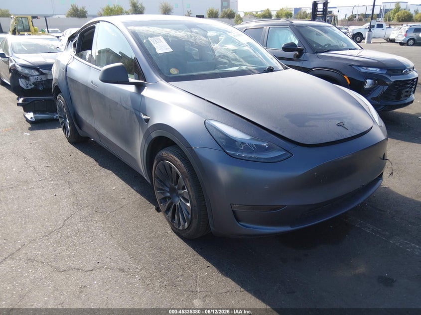 2023 Tesla Model y VIN 7SAYGDEE1PA166677 IAAI salvage auction — REAR END, Salvage Title, sold $10,300 on 2026-07-24 (photo 1)