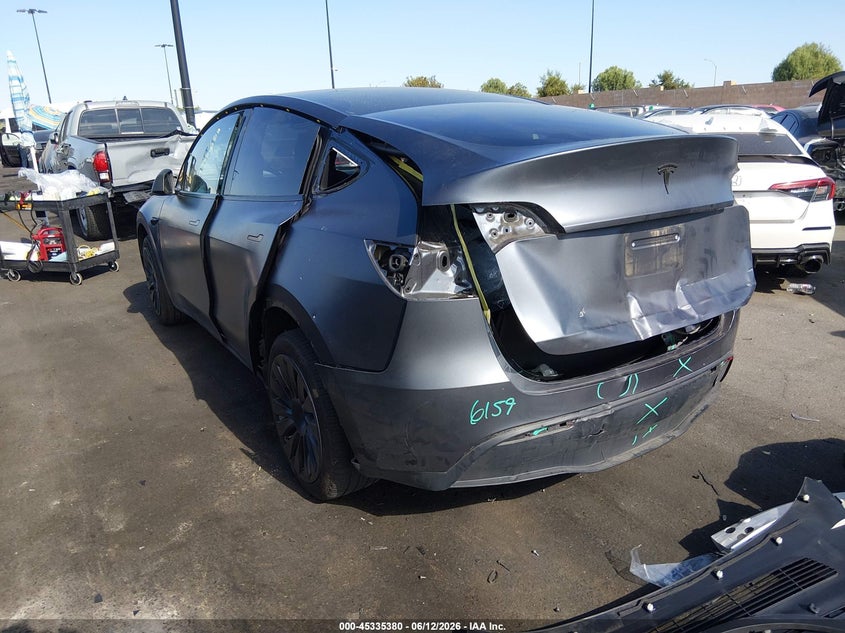 2023 Tesla Model y VIN 7SAYGDEE1PA166677 IAAI salvage auction — REAR END, Salvage Title, sold $10,300 on 2026-07-24 (photo 3)