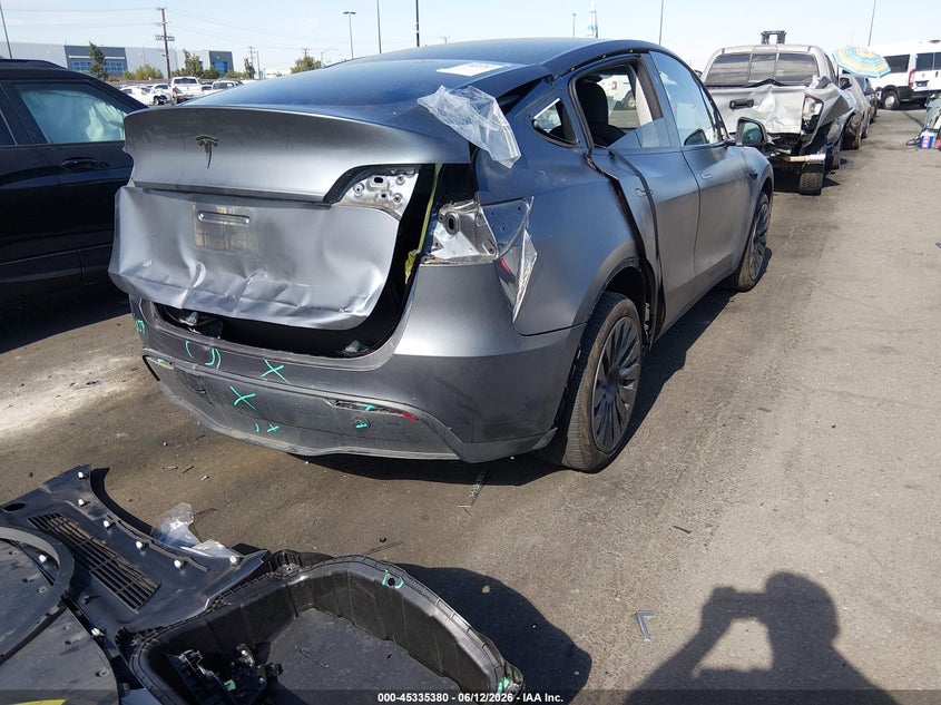 2023 Tesla Model y VIN 7SAYGDEE1PA166677 IAAI salvage auction — REAR END, Salvage Title, sold $10,300 on 2026-07-24 (photo 4)