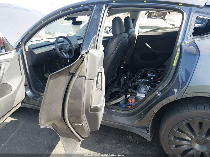 2023 Tesla Model y VIN 7SAYGDEE1PA166677 IAAI salvage auction — REAR END, Salvage Title, sold $10,300 on 2026-07-24 (photo 8)