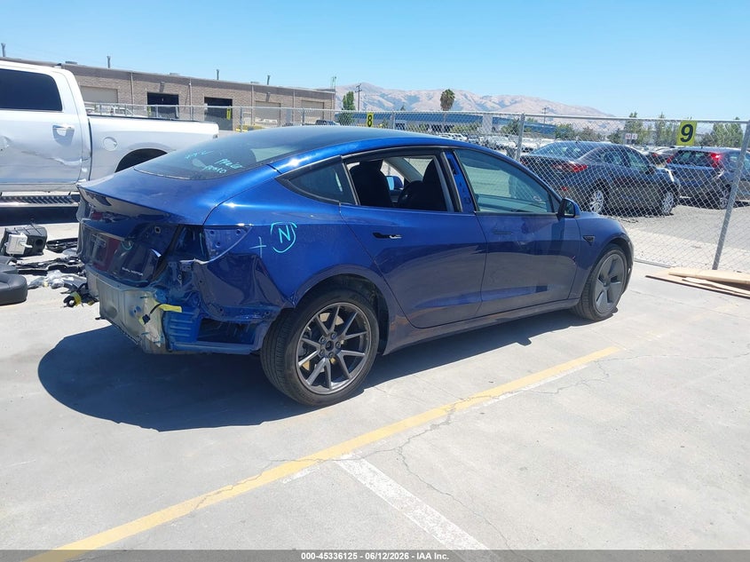 2022 Tesla Model 3 VIN 5YJ3E1EB3NF366381 IAAI salvage auction — REAR END, Salvage Title, sold $9,100 on 2026-07-29 (photo 4)