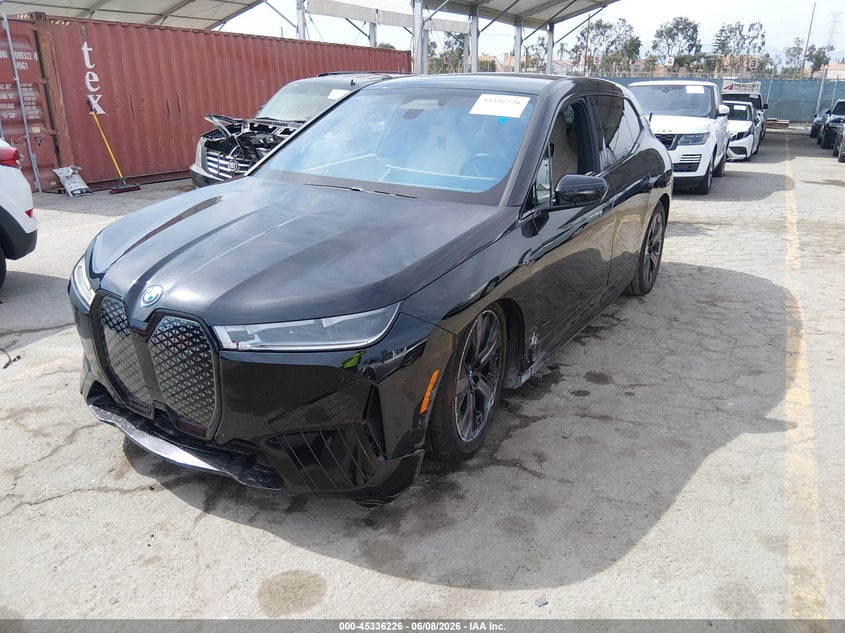2024 BMW Ix VIN WB523CF06RCR48869 IAAI salvage auction — LEFT SIDE, Salvage Title, sold $32,500 on 2026-08-17 (photo 2)