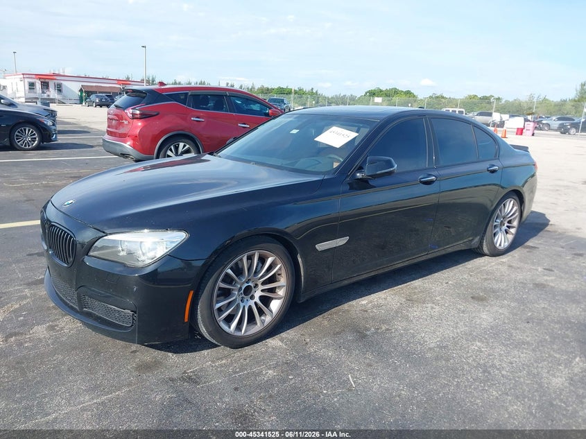 2015 BMW 7er VIN WBAYA6C5XFD827089 IAAI salvage auction — WATER/FLOOD, Rebuildable (Florida), sold $825 on 2026-07-16 (photo 2)