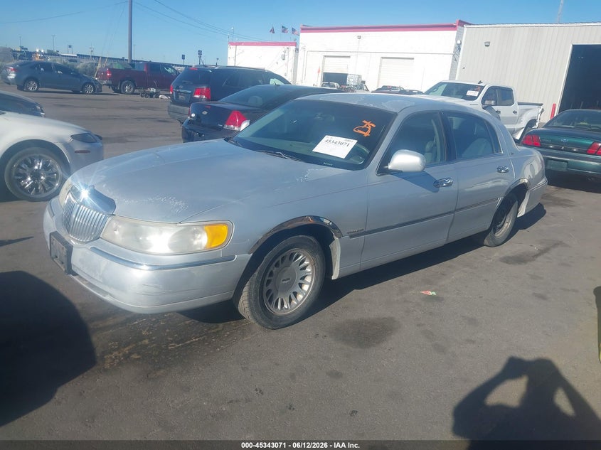 1999 Lincoln TOWN CAR VIN 1LNHM83W3XY641673 IAAI salvage auction — FRONT & REAR, Clear (Utah), sold $275 on 2026-07-09 (photo 2)