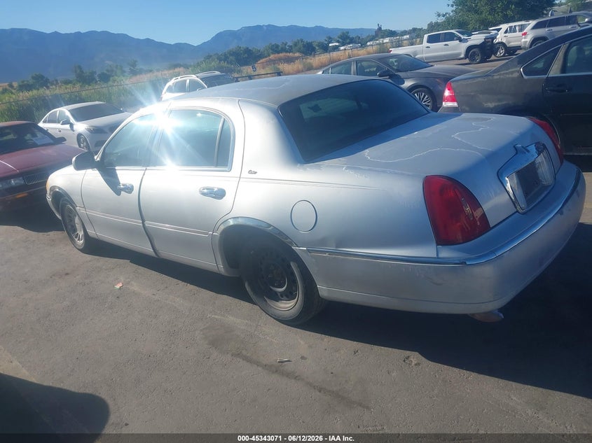 1999 Lincoln TOWN CAR VIN 1LNHM83W3XY641673 IAAI salvage auction — FRONT & REAR, Clear (Utah), sold $275 on 2026-07-09 (photo 3)