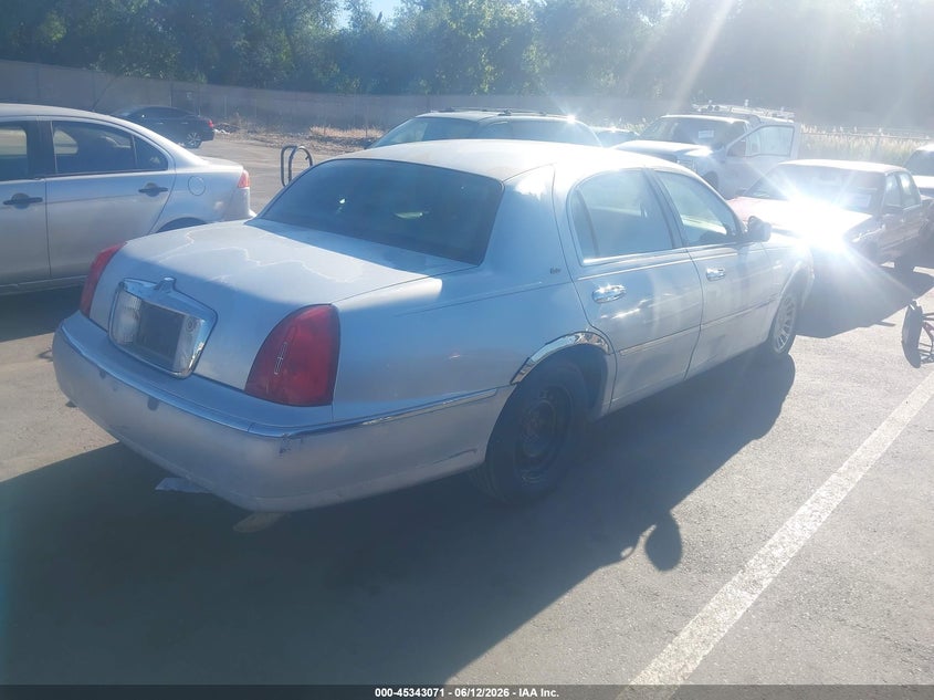 1999 Lincoln TOWN CAR VIN 1LNHM83W3XY641673 IAAI salvage auction — FRONT & REAR, Clear (Utah), sold $275 on 2026-07-09 (photo 4)