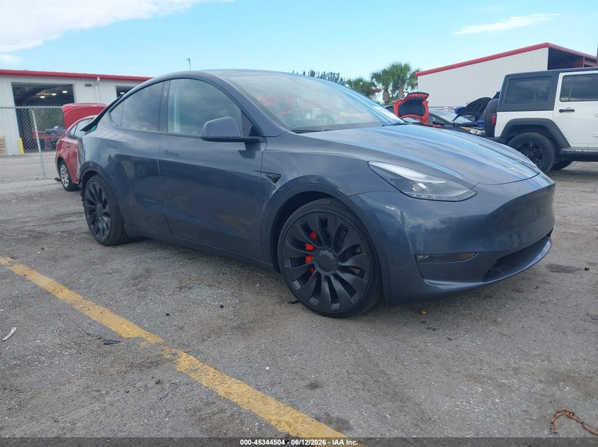 2023 Tesla Model y VIN 7SAYGDEF4PF861702 — IAAI salvage auction photo