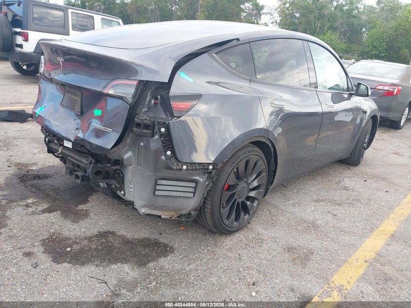 2023 Tesla Model y VIN 7SAYGDEF4PF861702 IAAI salvage auction — REAR END, Salvage Title, sold $13,150 on 2026-07-30 (photo 4)