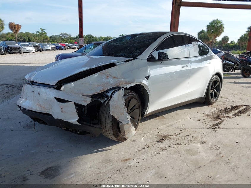 2026 Tesla Model y VIN 7SAYGDED4TA690987 IAAI salvage auction — FRONT & REAR, Salvage Title, sold $11,600 on 2026-07-23 (photo 2)