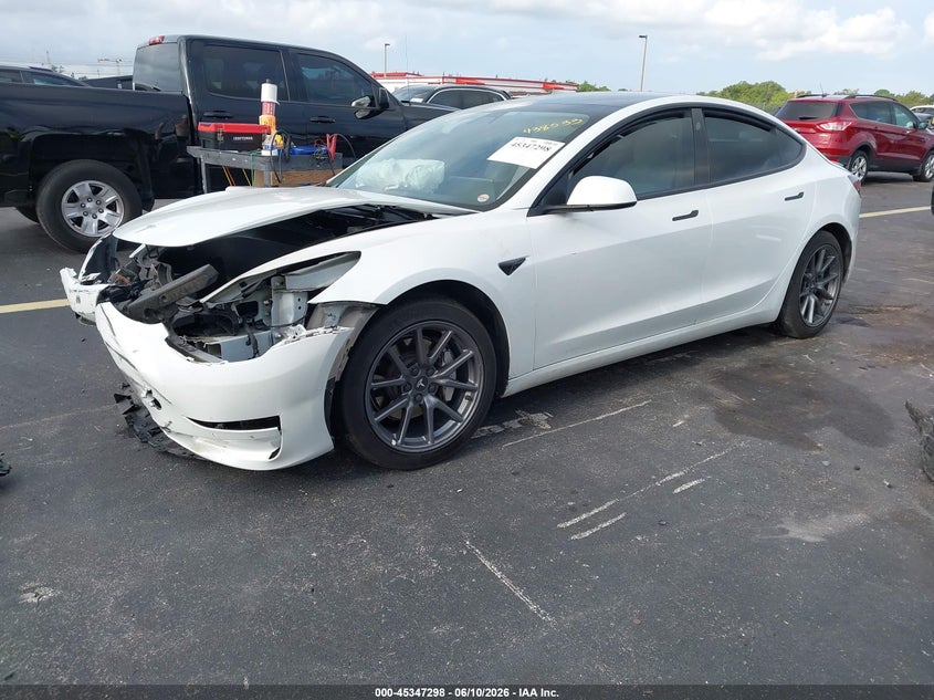 2021 Tesla Model 3 VIN 5YJ3E1EA2MF908558 IAAI salvage auction — FRONT & REAR, Salvage Title, sold $1,650 on 2026-07-17 (photo 2)