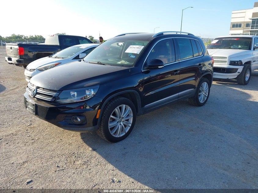 2014 Volkswagen Tiguan VIN WVGAV3AX2EW569614 IAAI salvage auction — WATER/FLOOD, Salvage (Texas), sold $500 on 2026-07-28 (photo 2)