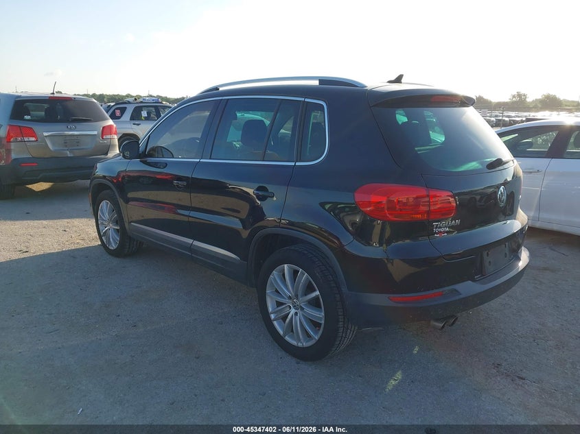 2014 Volkswagen Tiguan VIN WVGAV3AX2EW569614 IAAI salvage auction — WATER/FLOOD, Salvage (Texas), sold $500 on 2026-07-28 (photo 3)