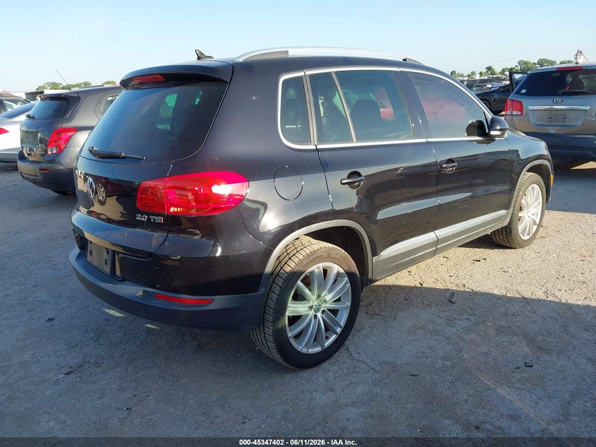 2014 Volkswagen Tiguan VIN WVGAV3AX2EW569614 IAAI salvage auction — WATER/FLOOD, Salvage (Texas), sold $500 on 2026-07-28 (photo 4)