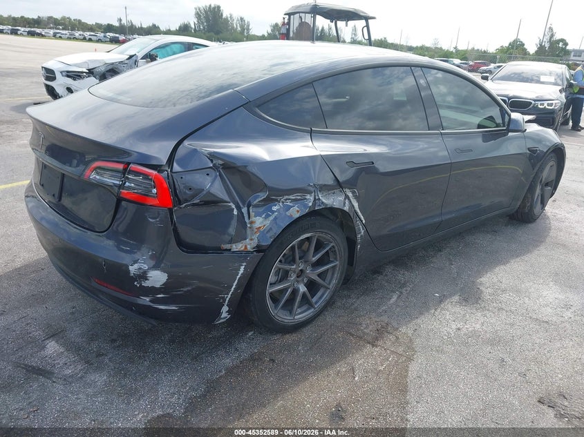 2021 Tesla Model 3 VIN 5YJ3E1EA5MF991452 IAAI salvage auction — NORMAL WEAR, Salvage (Florida), sold $5,575 on 2026-07-09 (photo 4)