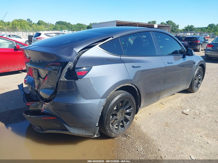 2023 Tesla Model y VIN 7SAYGDEE6PA050584 IAAI salvage auction — REAR END, Salvage Title, sold $10,000 on 2026-07-26 (photo 4)