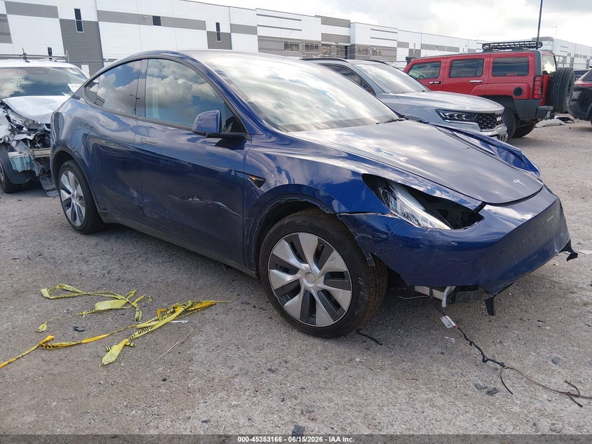 2023 Tesla Model y VIN 7SAYGDEE2PA054115 IAAI salvage auction — SIDE, Wait Title, sold $8,100 on 2026-08-02 (photo 1)