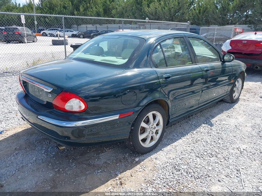 2004 Jaguar X type VIN SAJEB52D04XD67687 IAAI salvage auction — NORMAL WEAR, Clear (Florida), sold $425 on 2026-07-09 (photo 4)
