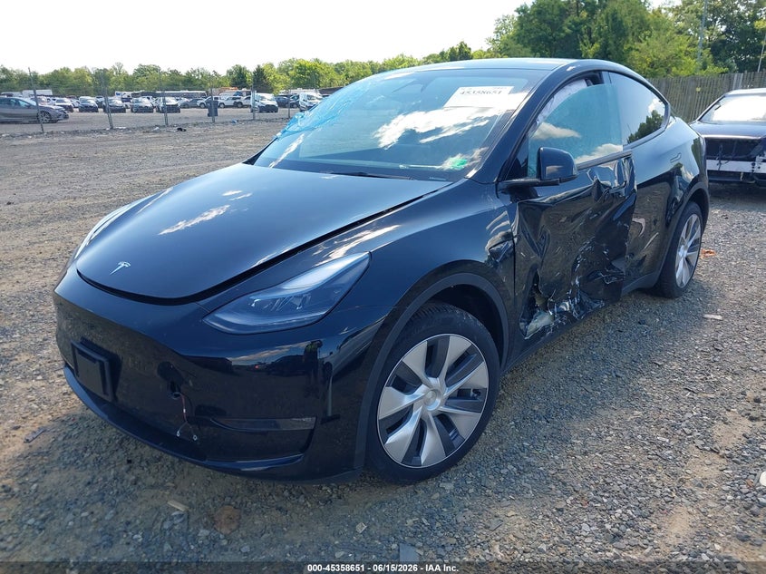 2023 Tesla Model y VIN 7SAYGDEE6PA171700 IAAI salvage auction — SIDE, Salvage (Virginia), sold $11,800 on 2026-07-11 (photo 2)