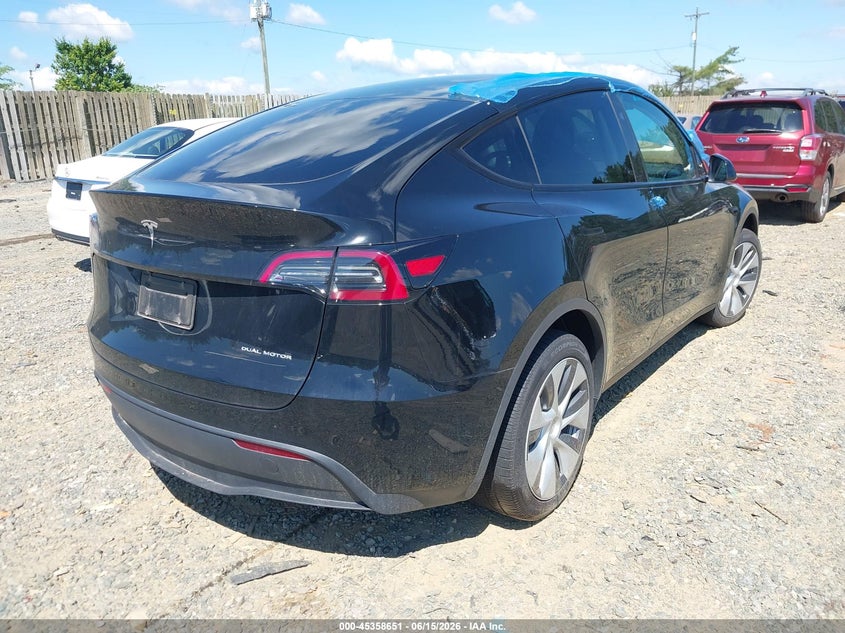 2023 Tesla Model y VIN 7SAYGDEE6PA171700 IAAI salvage auction — SIDE, Salvage (Virginia), sold $11,800 on 2026-07-11 (photo 4)