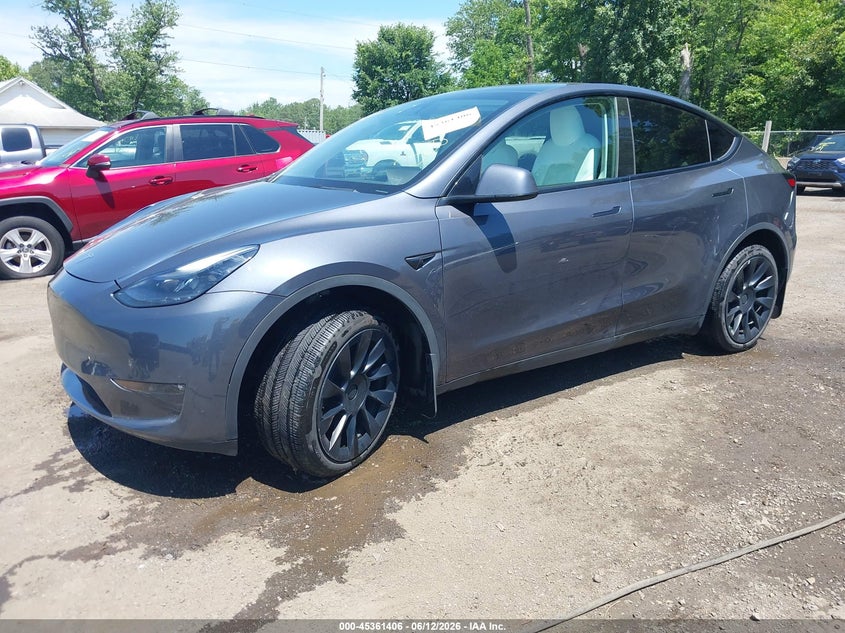 2023 Tesla Model y VIN 7SAYGDEE2PF692514 IAAI salvage auction — RIGHT FRONT, Salvage (Virginia), sold $12,000 on 2026-07-08 (photo 2)