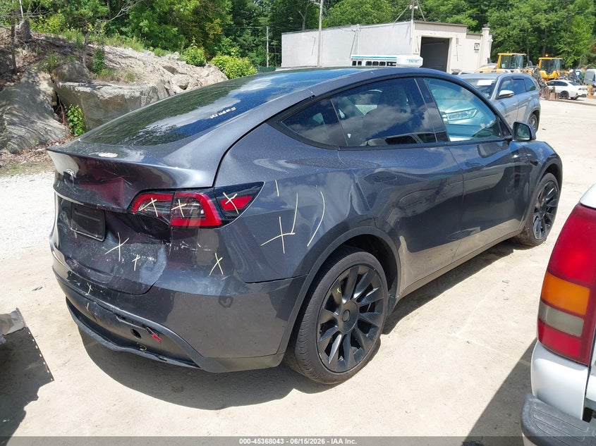 2023 Tesla Model y VIN 7SAYGDEE7PF878310 IAAI salvage auction — REAR END, Salvage Title, sold $10,000 on 2026-07-21 (photo 4)