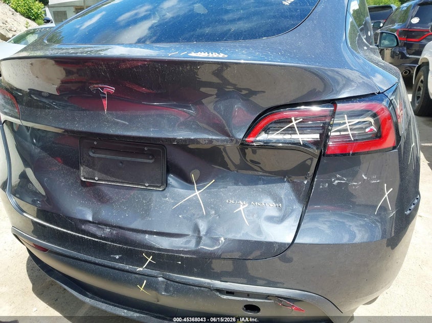 2023 Tesla Model y VIN 7SAYGDEE7PF878310 IAAI salvage auction — REAR END, Salvage Title, sold $10,000 on 2026-07-21 (photo 6)