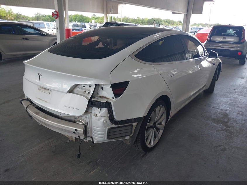 2020 Tesla Model 3 VIN 5YJ3E1EB6LF628777 IAAI salvage auction — LEFT SIDE, Rebuildable (Florida), sold $6,500 on 2026-07-23 (photo 4)