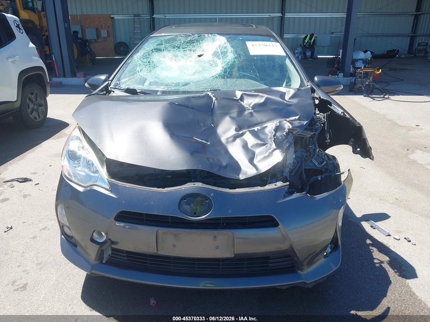 2014 Toyota Prius c VIN JTDKDTB37E1076192 IAAI salvage auction — FRONT END, Certificate Of Title (Nebraska), sold $700 on 2026-07-23 (photo 6)