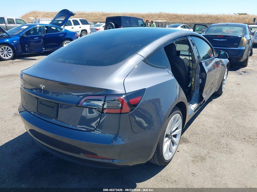 2023 Tesla Model 3 VIN 5YJ3E1EAXPF652870 IAAI salvage auction — SIDE, Salvage (California), sold $7,400 on 2026-07-16 (photo 4)