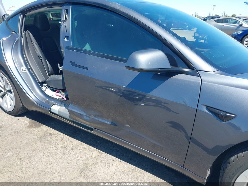 2023 Tesla Model 3 VIN 5YJ3E1EAXPF652870 IAAI salvage auction — SIDE, Salvage (California), sold $7,400 on 2026-07-16 (photo 6)