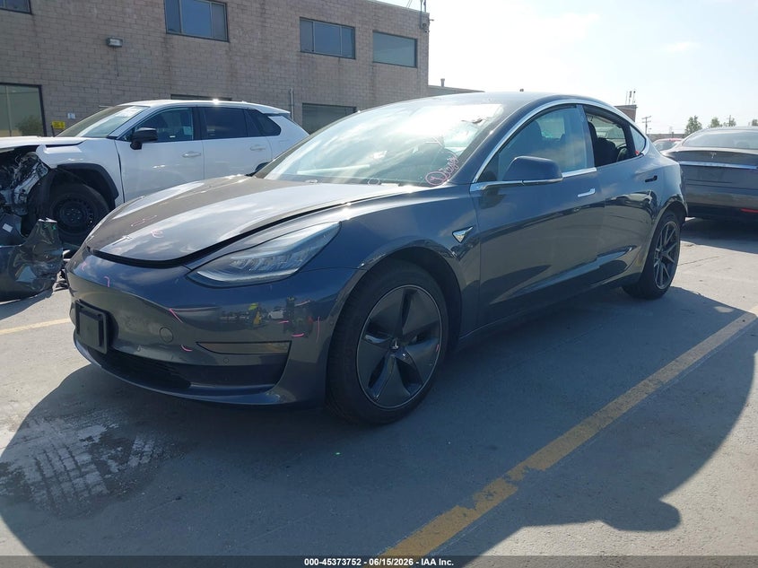 2020 Tesla Model 3 VIN 5YJ3E1EAXLF739310 IAAI salvage auction — LEFT REAR, Salvage Title, sold $6,000 on 2026-07-13 (photo 2)