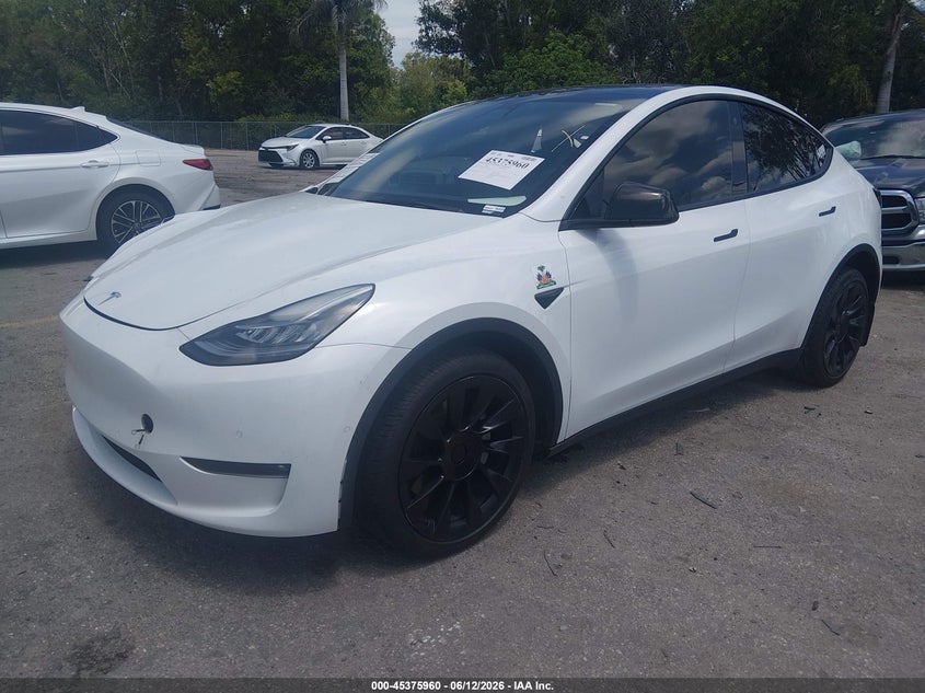 2022 Tesla Model y VIN 7SAYGDEE8NF481668 IAAI salvage auction — SIDE, Rebuildable (Florida), sold $8,200 on 2026-07-11 (photo 2)