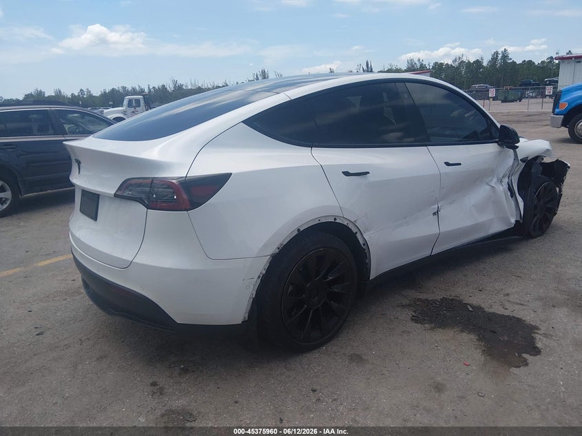 2022 Tesla Model y VIN 7SAYGDEE8NF481668 IAAI salvage auction — SIDE, Rebuildable (Florida), sold $8,200 on 2026-07-11 (photo 4)
