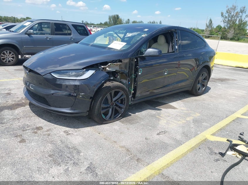 2026 Tesla Model x VIN 7SAXCBE51TF473212 IAAI salvage auction — VANDALISM, Salvage Title, sold $38,250 on 2026-07-23 (photo 2)