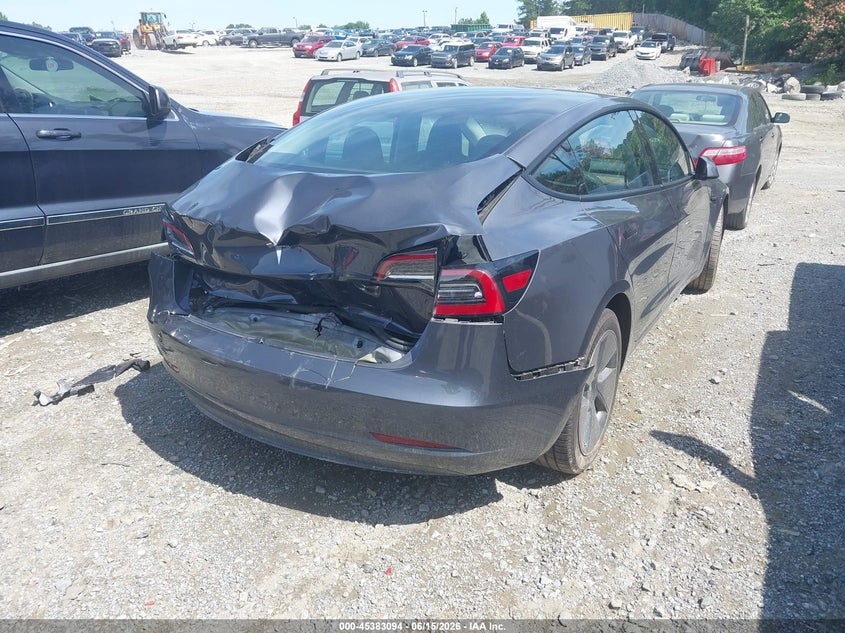 2023 Tesla Model 3 VIN 5YJ3E1EAXPF699736 IAAI salvage auction — REAR END, Salvage Title, sold $7,300 on 2026-08-01 (photo 4)