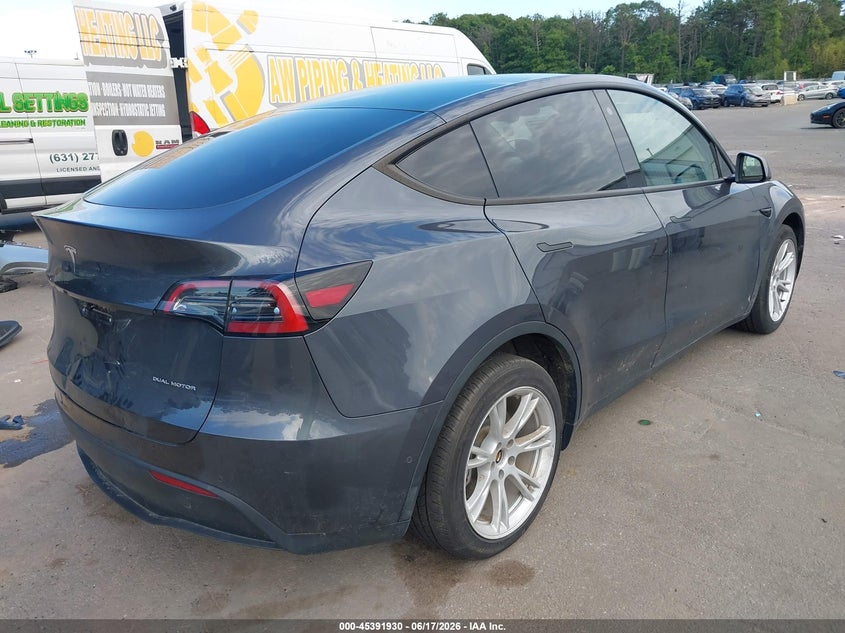2022 Tesla Model y VIN 7SAYGDEE5NF398442 IAAI salvage auction — WATER/FLOOD, Mv-907A (New York), sold $11,800 on 2026-07-07 (photo 4)