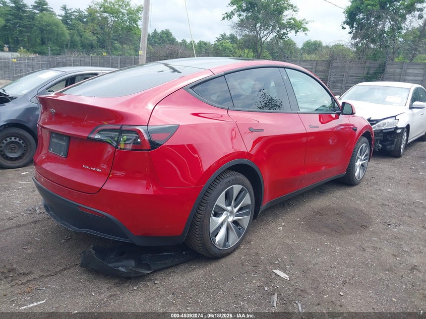 2022 Tesla Model y VIN 7SAYGAEE0NF392210 IAAI salvage auction — REAR END, Salvage (Massachusetts), sold $10,600 on 2026-07-29 (photo 4)
