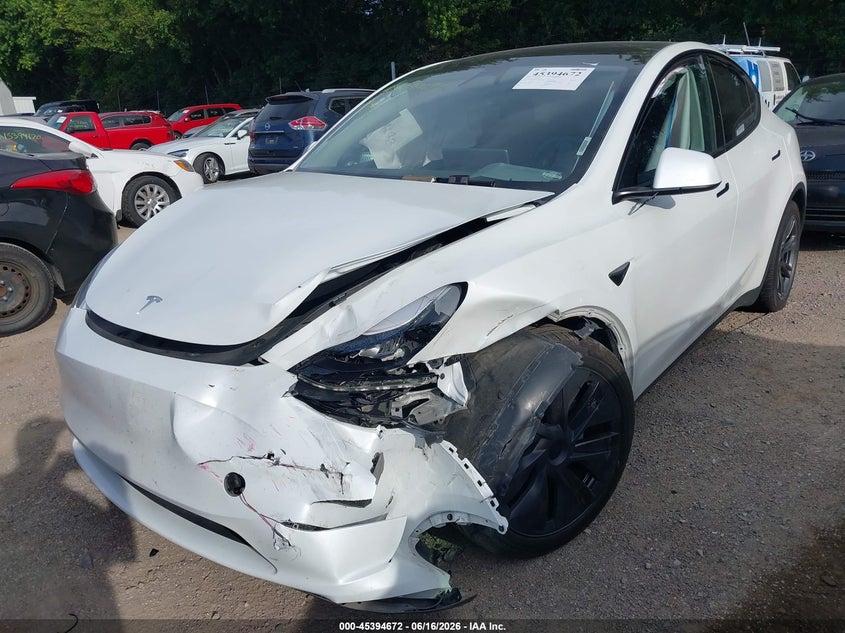 2024 Tesla Model y VIN 7SAYGAEE4RF201894 IAAI salvage auction — LEFT FRONT, Salvage (Indiana), sold $9,400 on 2026-07-11 (photo 6)