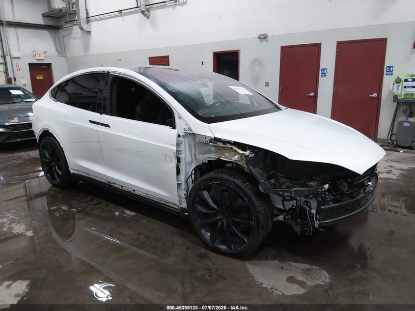 2018 Tesla Model x VIN 5YJXCDE23JF140599 IAAI salvage auction — FRONT & REAR, Salvage (Idaho), sold $7,900 on 2026-07-16 (photo 1)