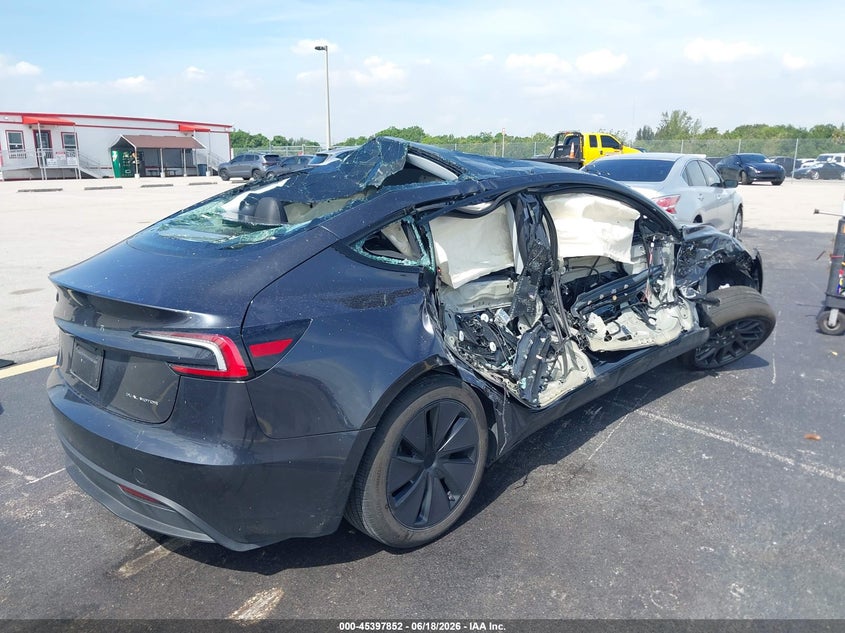2025 Tesla Model 3 VIN 5YJ3E1EB4SF908258 IAAI salvage auction — ROLLOVER, Salvage Title, sold $4,650 on 2026-07-24 (photo 4)