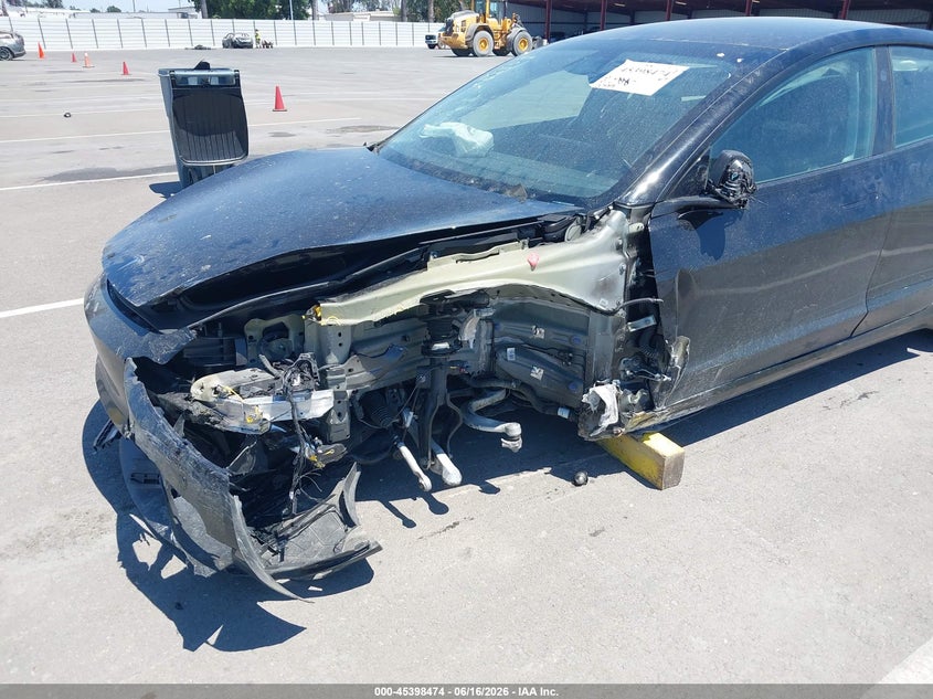 2025 Tesla Model 3 VIN 5YJ3E1ET6SF985335 IAAI salvage auction — LEFT FRONT, Salvage Title, sold $10,600 on 2026-07-21 (photo 6)
