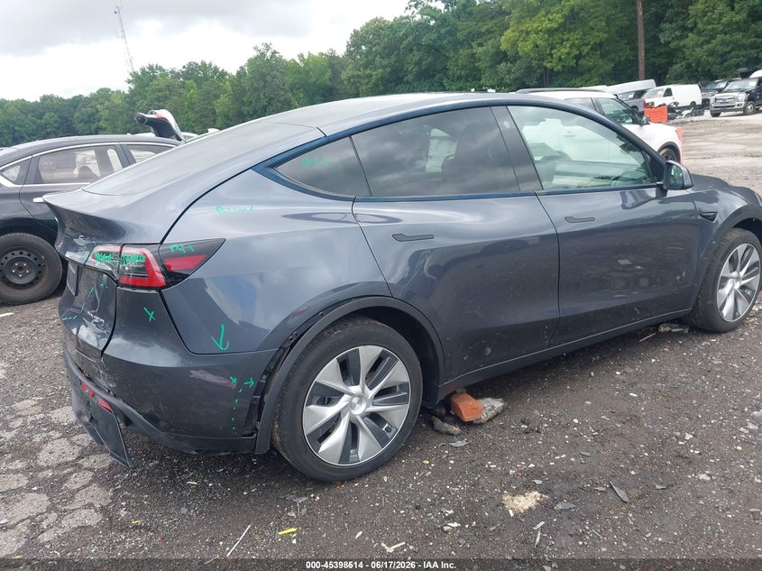 2023 Tesla Model y VIN 7SAYGDEE9PF710555 IAAI salvage auction — REAR END, Salvage (Georgia), sold $12,600 on 2026-07-29 (photo 4)