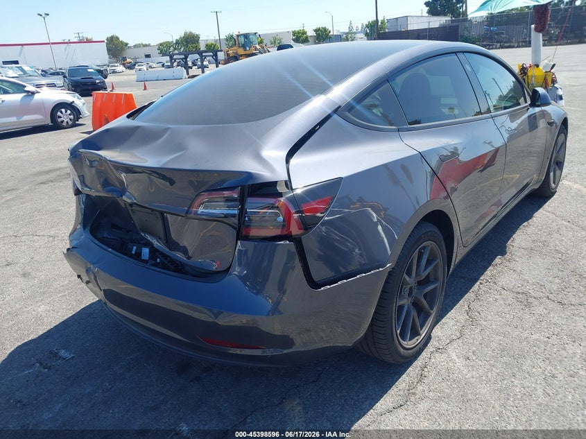 2023 Tesla Model 3 VIN 5YJ3E1EAXPF496412 IAAI salvage auction — REAR END, Salvage Title, sold $7,000 on 2026-07-29 (photo 4)