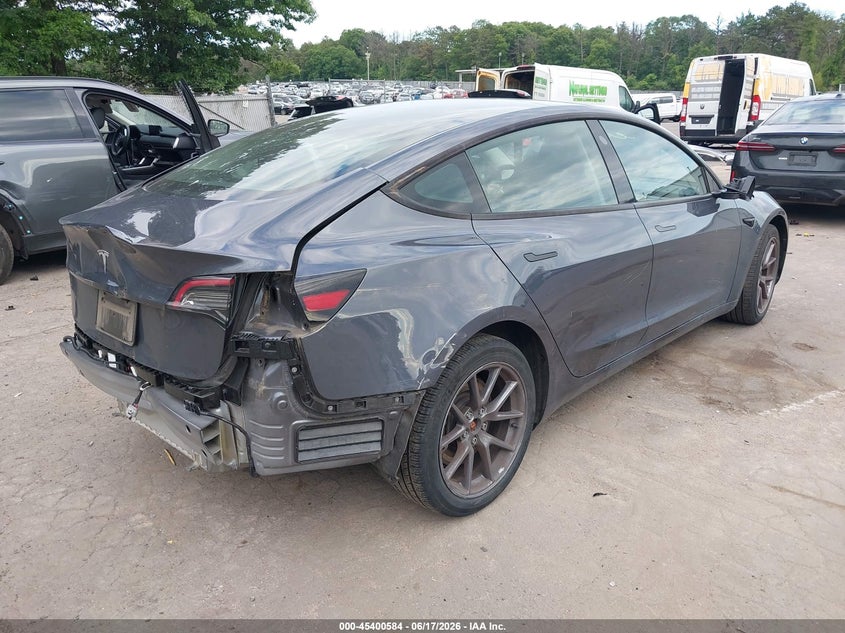 2023 Tesla Model 3 VIN 5YJ3E1EA7PF613248 IAAI salvage auction — REAR END, Mv-907A (New York), sold $8,950 on 2026-07-07 (photo 4)