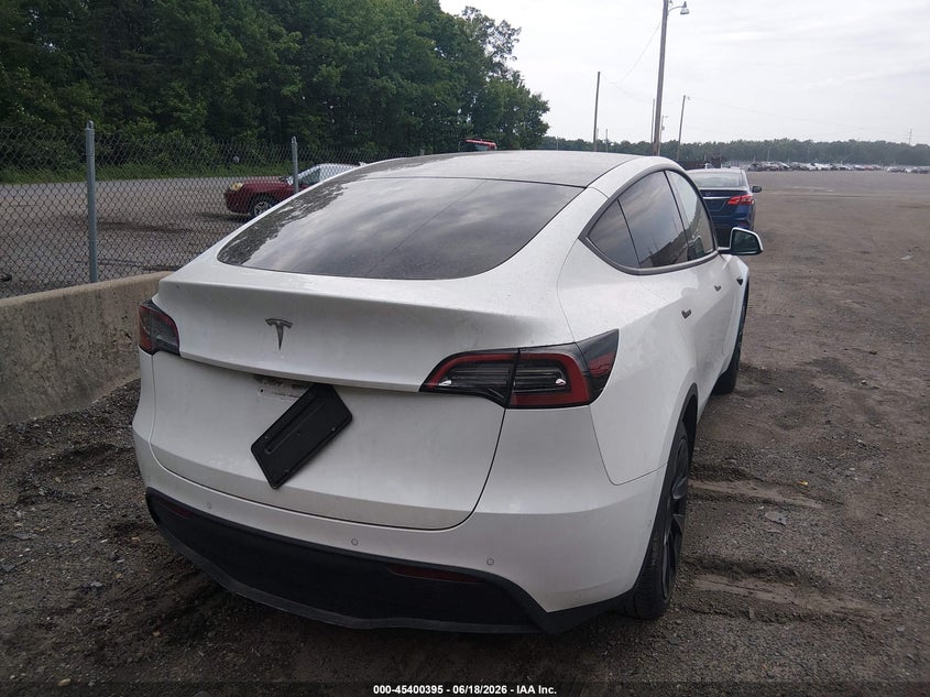 2021 Tesla Model y VIN 5YJYGDED9MF192785 IAAI salvage auction — UNKNOWN, Clear (Texas), sold $12,000 on 2026-07-08 (photo 4)